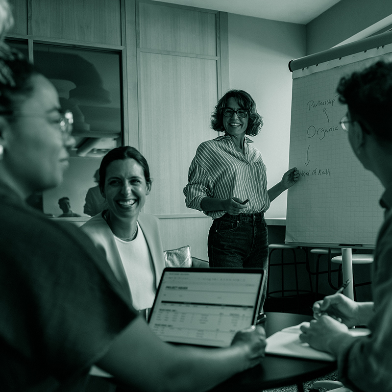 Team discussing strategies during a meeting in a modern office setting
